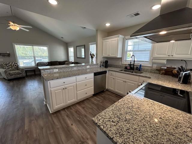 kitchen featuring stainless steel dishwasher, a sink, extractor fan, open floor plan, and a peninsula