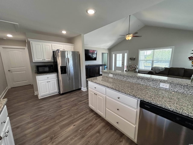 kitchen with stainless steel appliances, a ceiling fan, white cabinetry, vaulted ceiling, and open floor plan