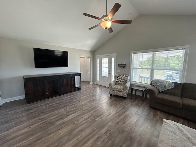 living area with ceiling fan, high vaulted ceiling, dark wood-style floors, a fireplace, and baseboards