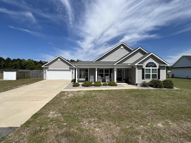 ranch-style home with driveway, an attached garage, and covered porch