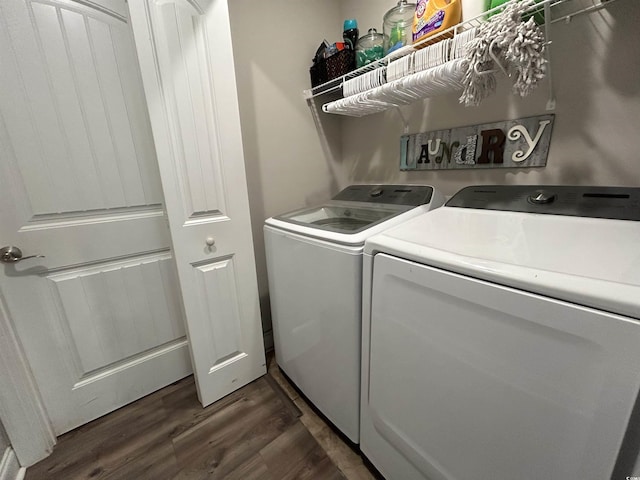 laundry area featuring dark wood-style flooring and washer and dryer