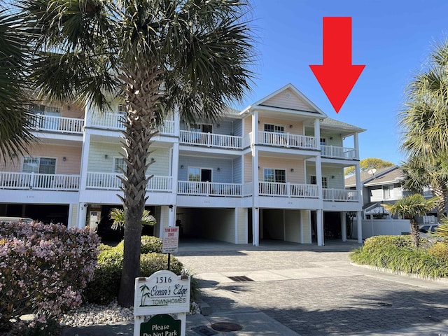 1516 Edge Dr Unit 101, North Myrtle Beach, SC 29582 - view of building exterior with decorative driveway