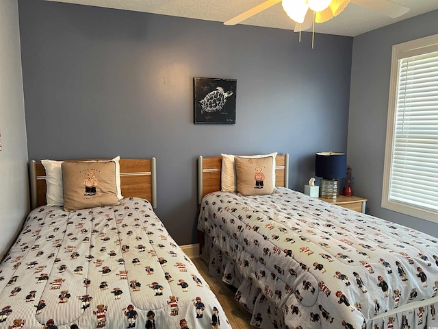 1516 Edge Dr Unit 101, North Myrtle Beach, SC 29582 - bedroom with ceiling fan and wood finished floors