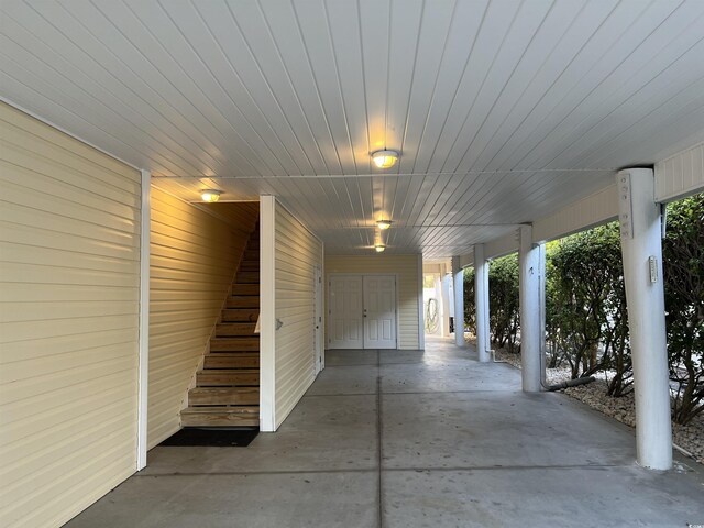 1516 Edge Dr Unit 101, North Myrtle Beach, SC 29582 - view of patio / terrace with stairs and an attached carport