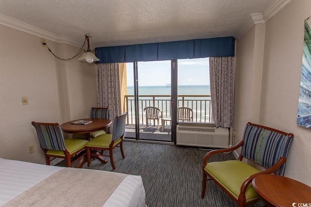1200 N Ocean Blvd N Unit 905, Myrtle Beach, SC 29577 - carpeted bedroom with a water view, access to exterior, ornamental molding, a textured ceiling, and multiple windows