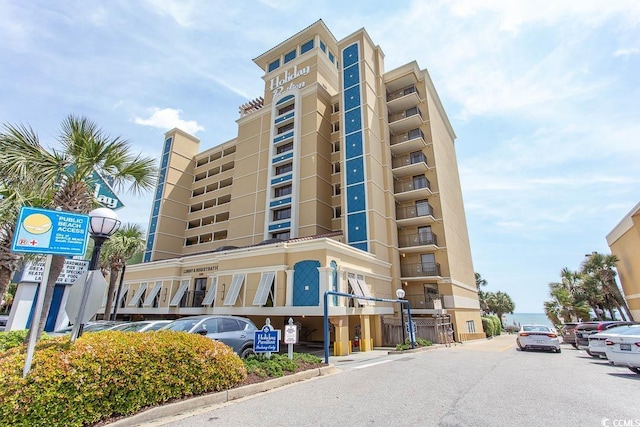 1200 N Ocean Blvd N Unit 905, Myrtle Beach, SC 29577 - view of building exterior featuring uncovered parking