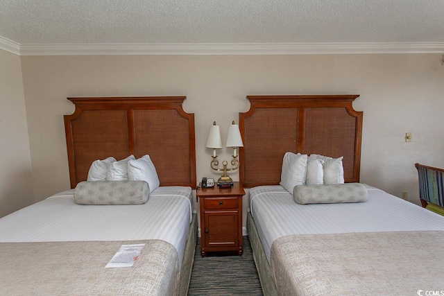 1200 N Ocean Blvd N Unit 905, Myrtle Beach, SC 29577 - bedroom with crown molding, a textured ceiling, and dark colored carpet