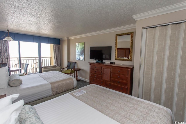 1200 N Ocean Blvd N Unit 905, Myrtle Beach, SC 29577 - carpeted bedroom with a textured ceiling, ornamental molding, and access to exterior