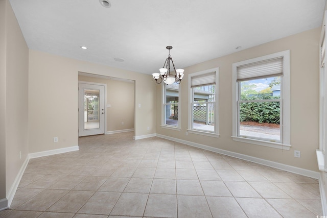 spare room with a chandelier, light tile patterned flooring, baseboards, and recessed lighting