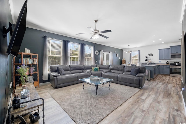 650 Woodman Dr, Conway, SC 29526 - living room with a ceiling fan, plenty of natural light, ornamental molding, light wood-style flooring, and a chandelier