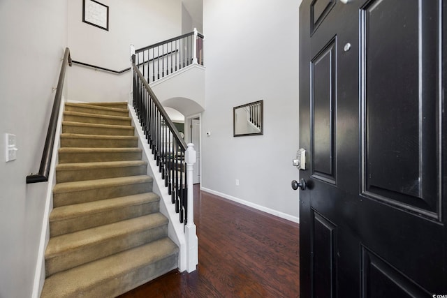 650 Woodman Dr, Conway, SC 29526 - foyer featuring wood finished floors, stairway, arched walkways, and a high ceiling