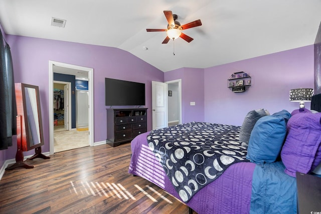 650 Woodman Dr, Conway, SC 29526 - bedroom with wood finished floors, vaulted ceiling, and a ceiling fan