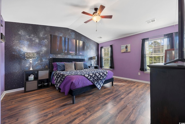 650 Woodman Dr, Conway, SC 29526 - bedroom with lofted ceiling, wood finished floors, ceiling fan, and an accent wall