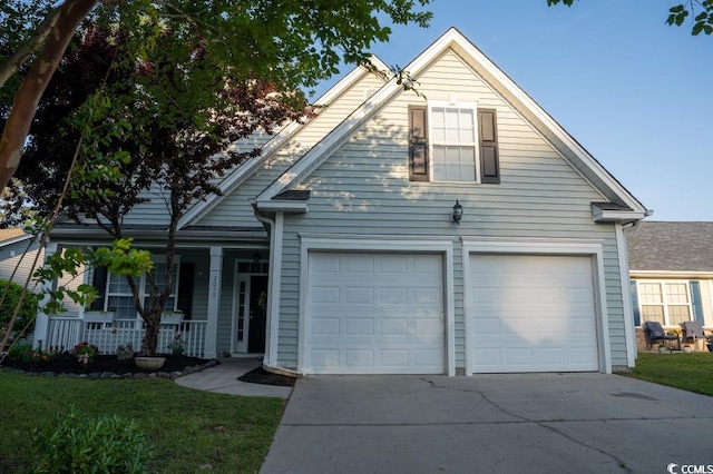 view of front of property with concrete driveway and a porch