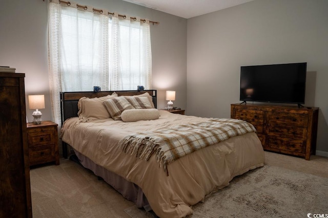 bedroom with light colored carpet
