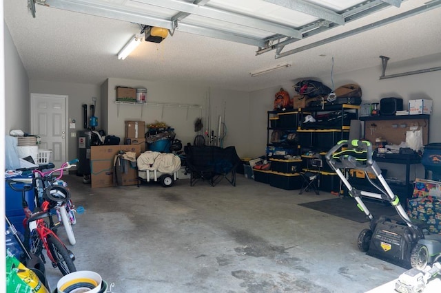 garage with a garage door opener and water heater