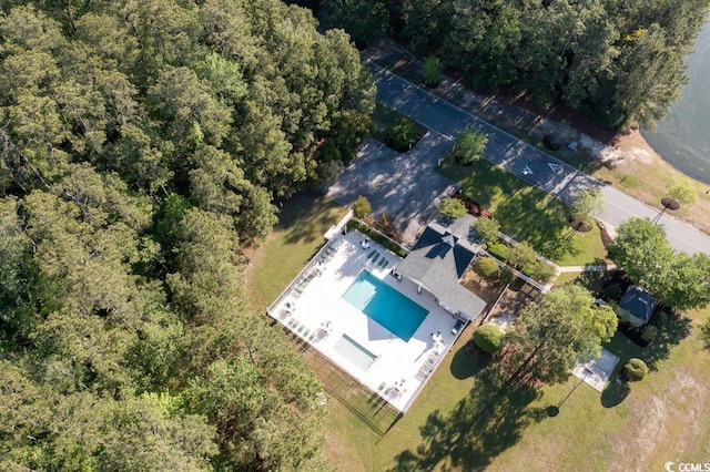 view of subject property with a pool