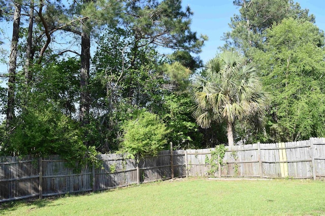 view of yard with a fenced backyard