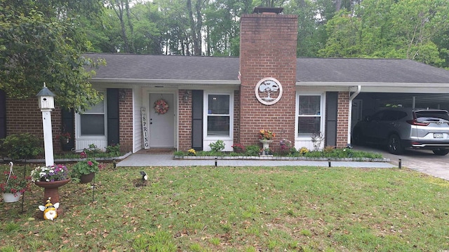 single story home with a chimney, roof with shingles, a carport, brick siding, and a front yard