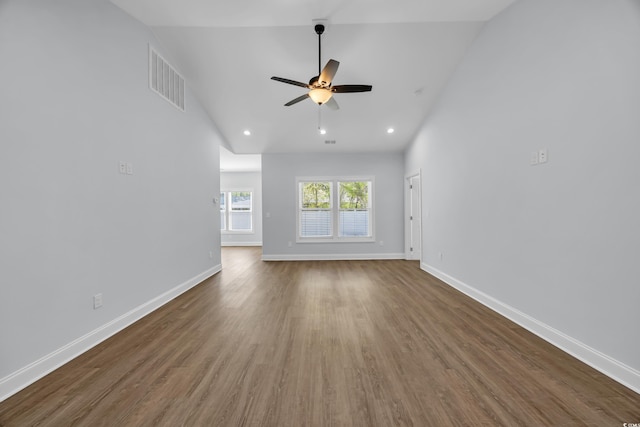 5132 Little River Neck Rd, North Myrtle Beach, SC 29582 - unfurnished living room with wood finished floors, visible vents, baseboards, ceiling fan, and vaulted ceiling