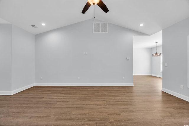 5132 Little River Neck Rd, North Myrtle Beach, SC 29582 - spare room with wood finished floors, visible vents, vaulted ceiling, ceiling fan, and baseboards