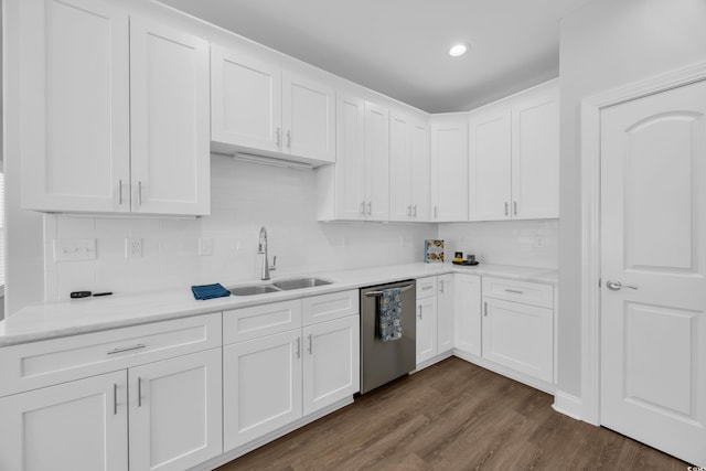 5132 Little River Neck Rd, North Myrtle Beach, SC 29582 - kitchen with backsplash, white cabinetry, stainless steel dishwasher, and a sink