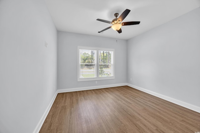 5132 Little River Neck Rd, North Myrtle Beach, SC 29582 - spare room featuring wood finished floors, baseboards, and ceiling fan