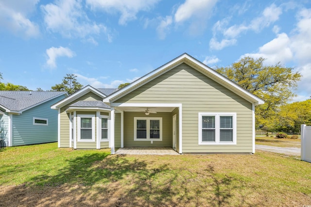 5132 Little River Neck Rd, North Myrtle Beach, SC 29582 - rear view of house with a ceiling fan, a patio area, and a lawn