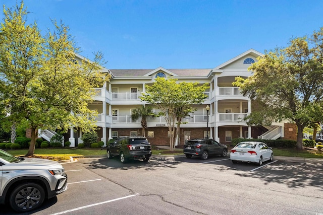 view of property with uncovered parking