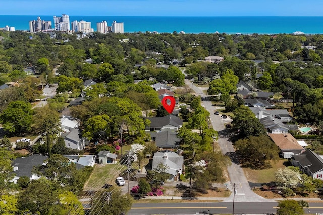 710 Yucca Ave, Myrtle Beach, SC 29577 - aerial overview of property's location with a tree filled landscape and a large body of water