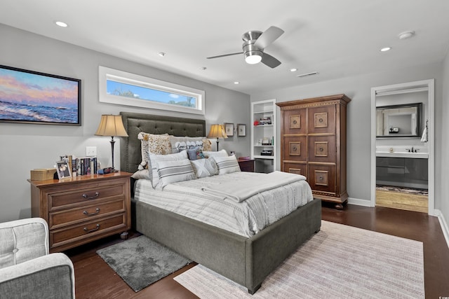 710 Yucca Ave, Myrtle Beach, SC 29577 - bedroom with dark wood-style floors, recessed lighting, ceiling fan, ensuite bathroom, and baseboards