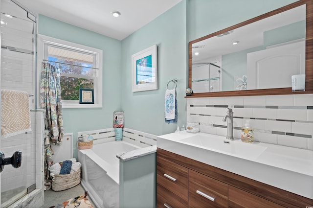 710 Yucca Ave, Myrtle Beach, SC 29577 - full bathroom with a stall shower, vanity, a garden tub, decorative backsplash, and recessed lighting