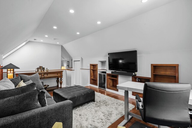 living room featuring wood finished floors, recessed lighting, lofted ceiling, and an office area