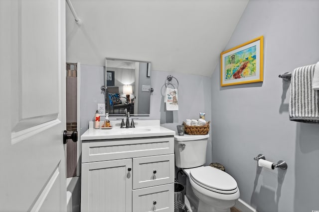 710 Yucca Ave, Myrtle Beach, SC 29577 - bathroom with toilet, vaulted ceiling, vanity, and baseboards