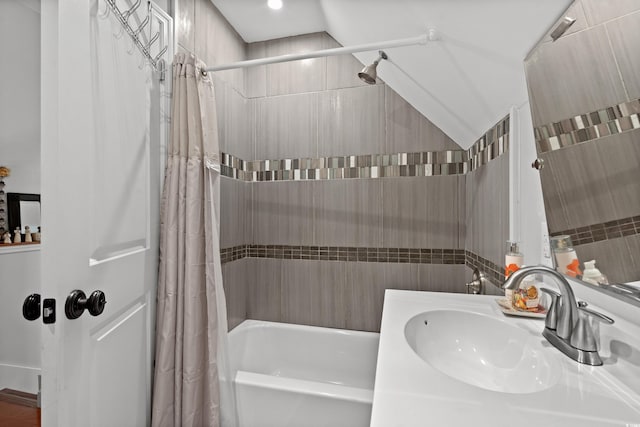 bathroom with shower / bath combo with shower curtain and vanity