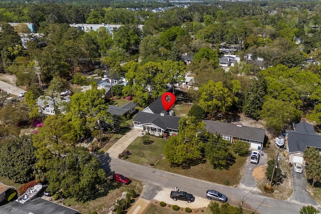 aerial view of property's location with nearby suburban area