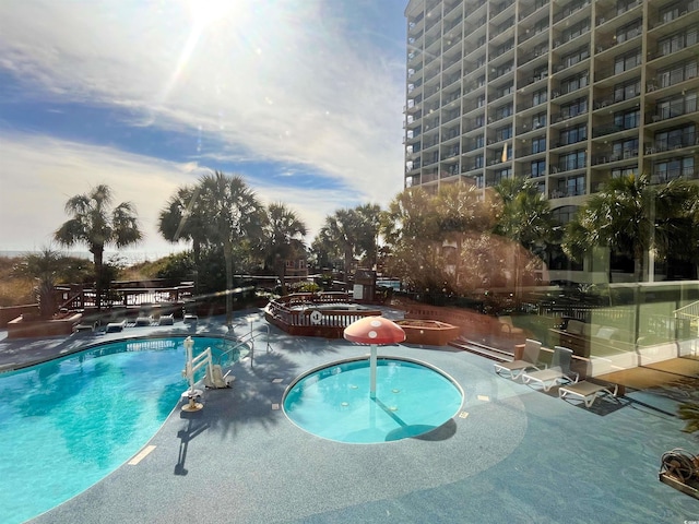 pool with a patio area