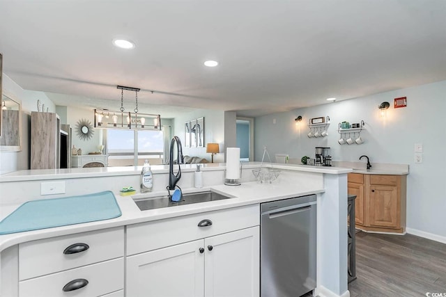 6100 N Ocean Blvd Unit 804, North Myrtle Beach, SC 29582 - kitchen featuring stainless steel dishwasher, a sink, light countertops, dark wood-style flooring, and white cabinets