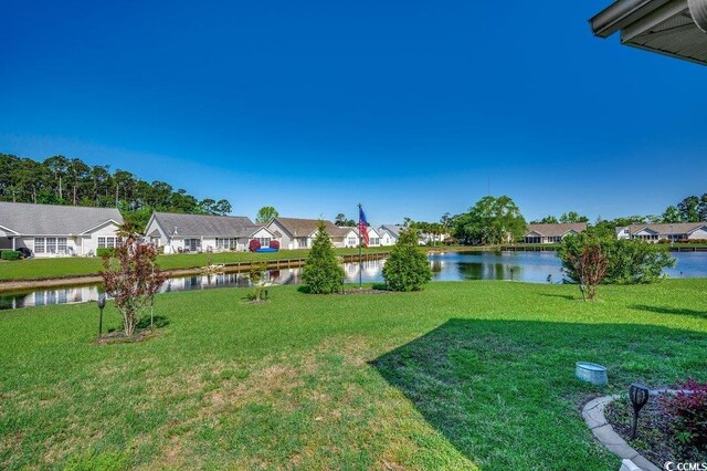 1154 Lampwick Ln, Murrells Inlet, SC 29576 - view of green lawn featuring a residential view and a water view