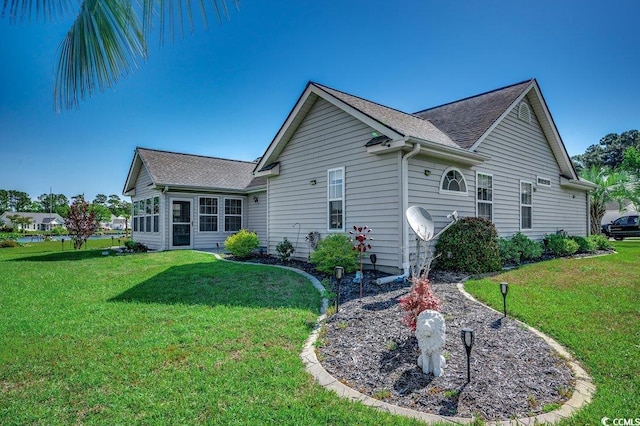 1154 Lampwick Ln, Murrells Inlet, SC 29576 - view of home's exterior featuring a yard and roof with shingles