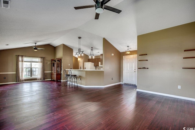 1154 Lampwick Ln, Murrells Inlet, SC 29576 - unfurnished living room with ceiling fan, lofted ceiling, baseboards, and dark wood-style floors