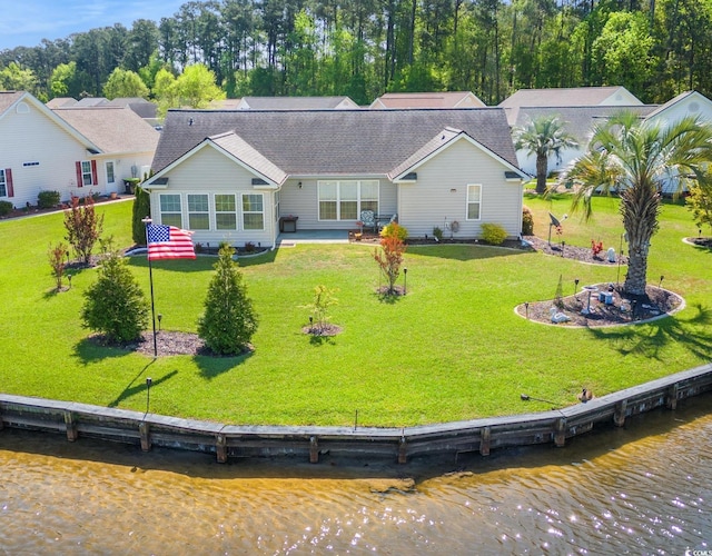 1154 Lampwick Ln, Murrells Inlet, SC 29576 - back of property featuring a lawn, a water view, and a shingled roof