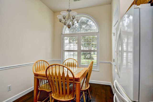 2705 S Key Largo Cir, Myrtle Beach, SC 29577 - dining room featuring a chandelier, healthy amount of natural light, and dark wood-style floors