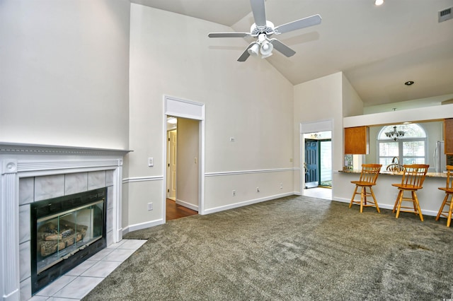 2705 S Key Largo Cir, Myrtle Beach, SC 29577 - living area featuring high vaulted ceiling, carpet, ceiling fan, a tile fireplace, and baseboards