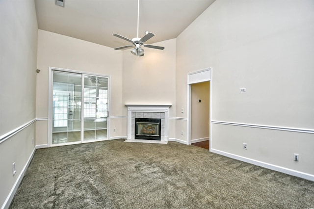 2705 S Key Largo Cir, Myrtle Beach, SC 29577 - unfurnished living room with carpet, a ceiling fan, a tiled fireplace, and baseboards