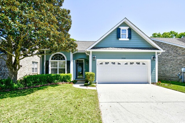 2705 S Key Largo Cir, Myrtle Beach, SC 29577 - view of front of home featuring a front yard, concrete driveway, and an attached garage