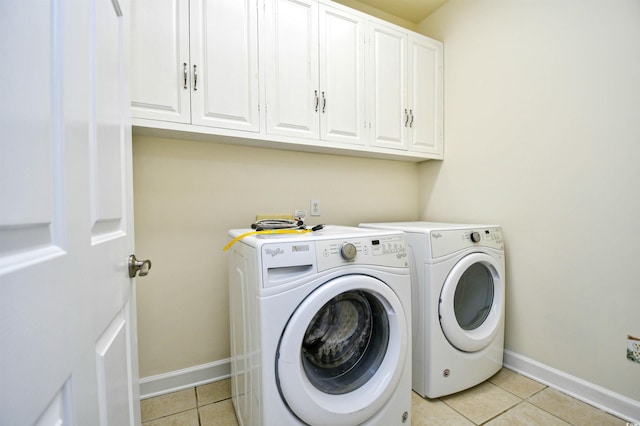 2705 S Key Largo Cir, Myrtle Beach, SC 29577 - laundry room featuring cabinet space, light tile patterned flooring, baseboards, and independent washer and dryer