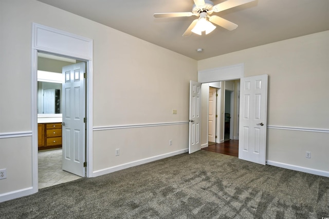 2705 S Key Largo Cir, Myrtle Beach, SC 29577 - unfurnished bedroom featuring carpet, baseboards, connected bathroom, and a ceiling fan