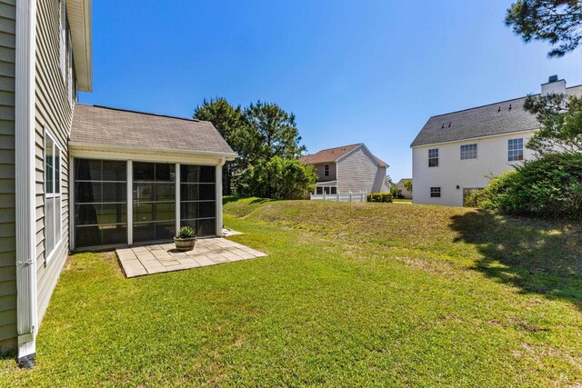 356 Whipple Run Loop, Myrtle Beach, SC 29588 - view of green lawn featuring a sunroom and a patio area