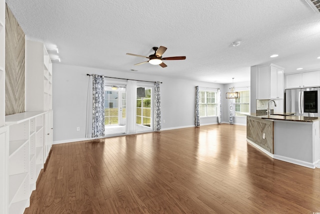 356 Whipple Run Loop, Myrtle Beach, SC 29588 - unfurnished living room with a textured ceiling, wood finished floors, a ceiling fan, and recessed lighting